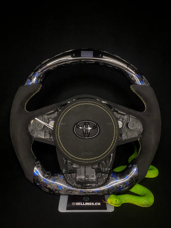 compare product Volant sport Toyota Supra Forged Carbon à éclats de couleur (LED)